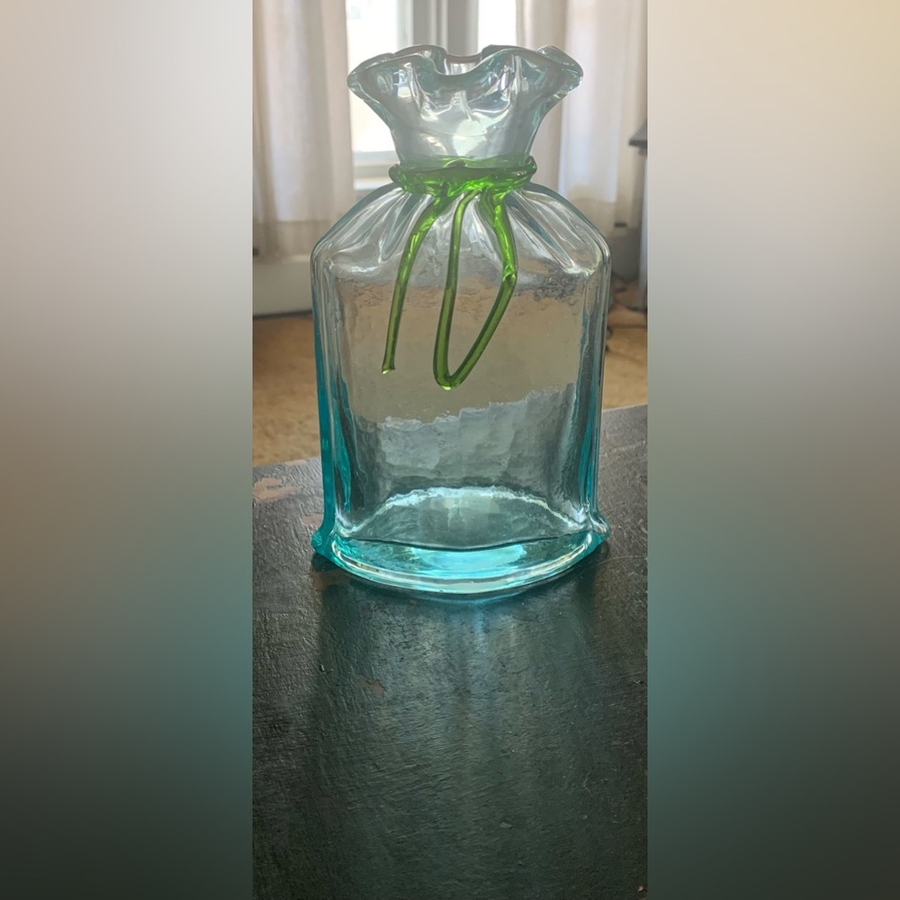 Heavy glass vase. Aqua with green glass bow trim.